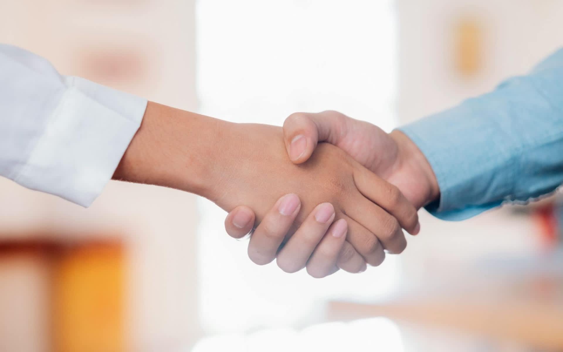 Real estate agent reviewing negotiation strategy with clients