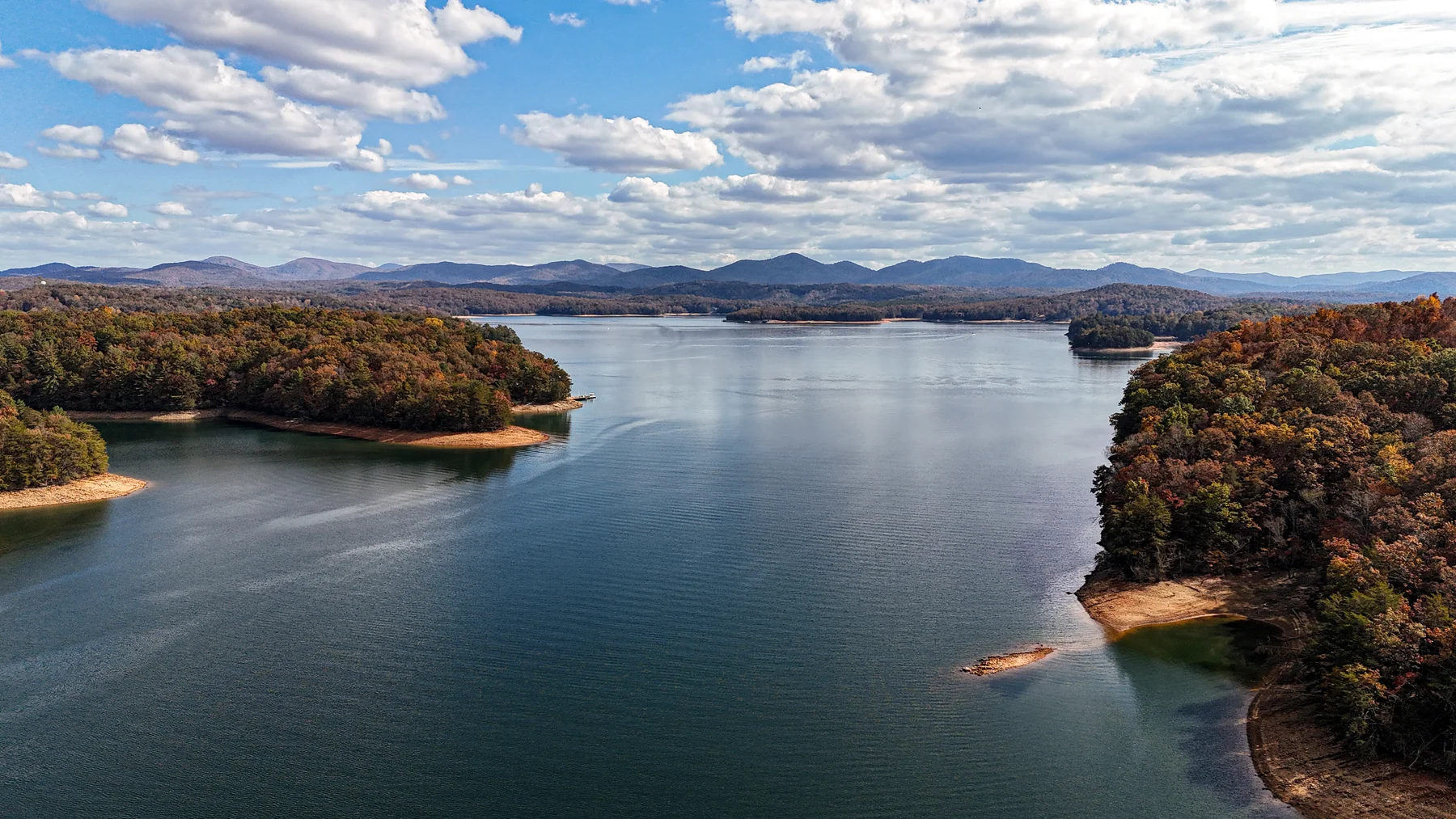 Aerial view of Lake Blue Ridge in fall, ringed by forested shoreline