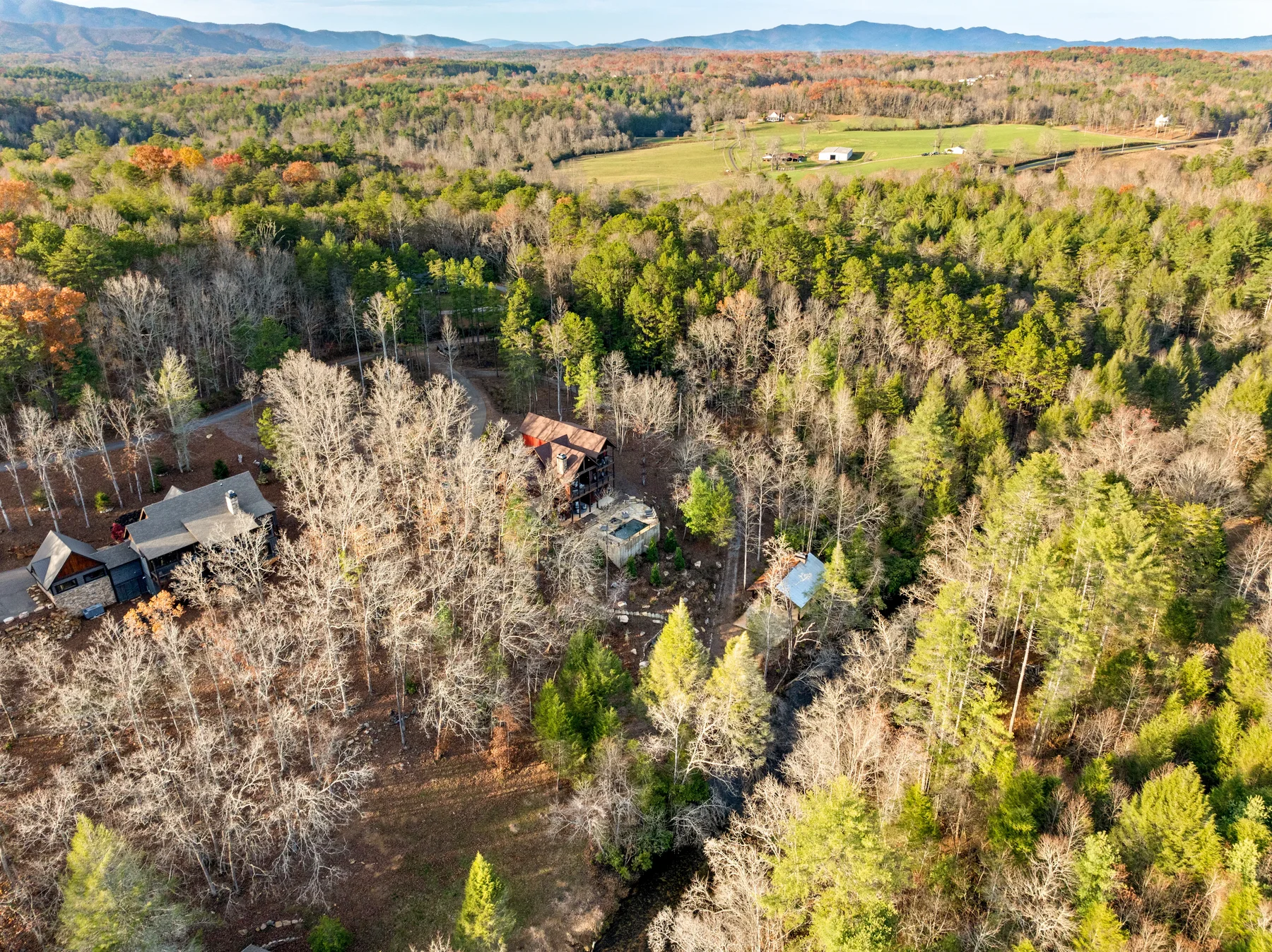 Aerial view of mountain homes tucked into the woods near Blue Ridge, Georgia