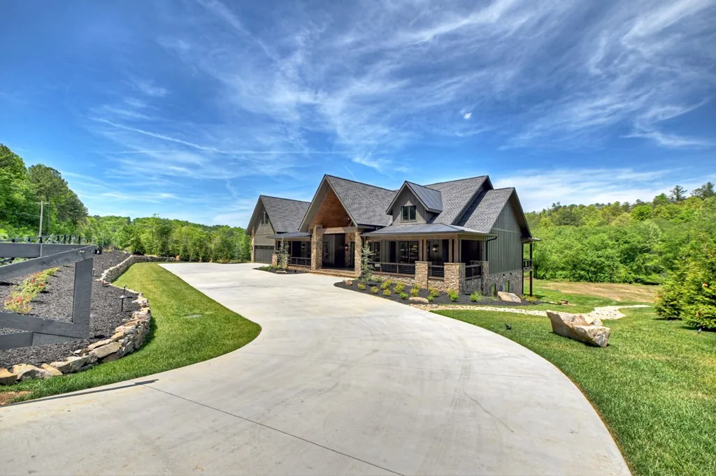 Mountain home at the end of a long concrete driveway