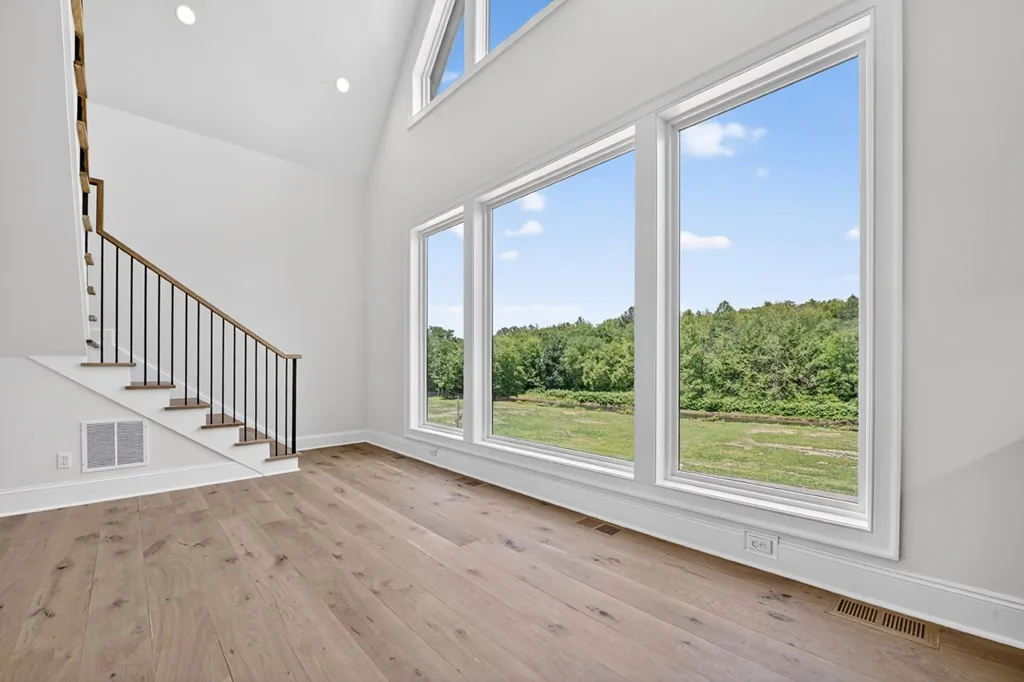Great room — vaulted ceilings, beams, oak floors