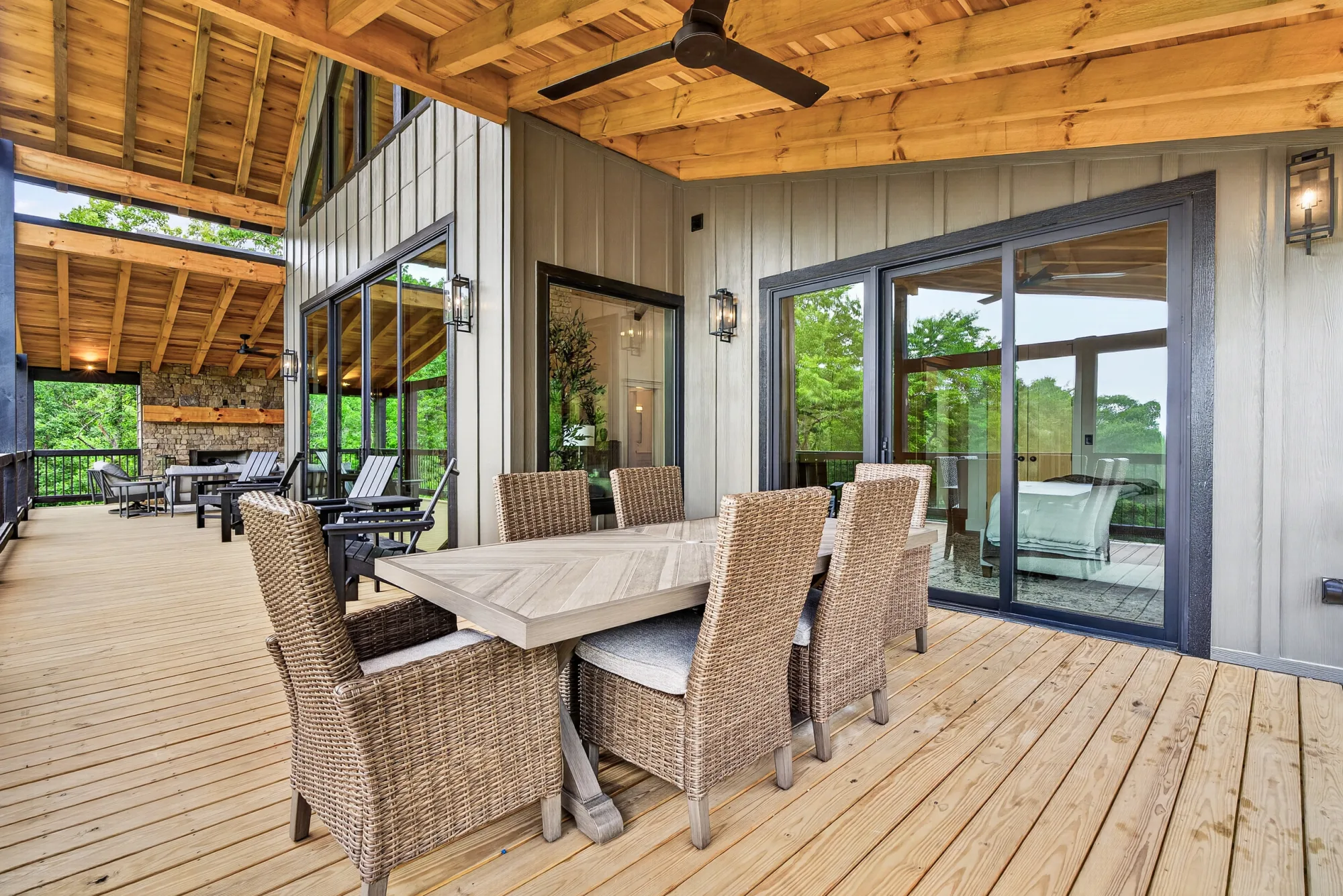 Outdoor dining table on a covered deck of a mountain home