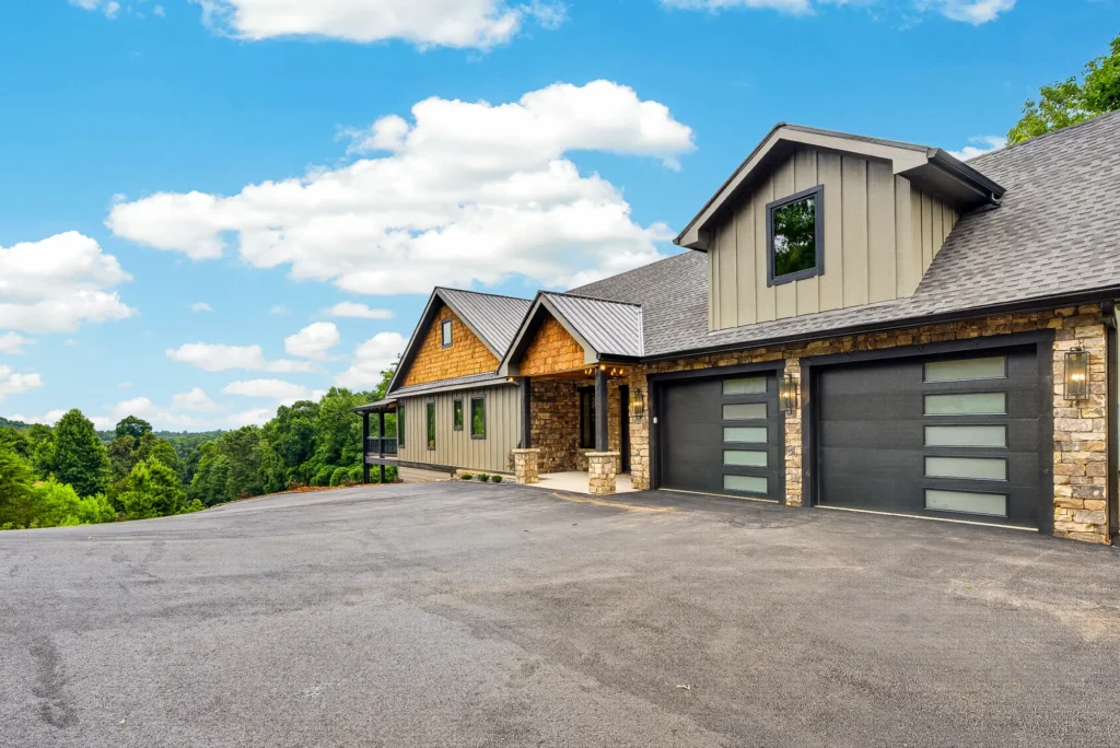 Craftsman-style mountain home exterior with stone accents and attached garage