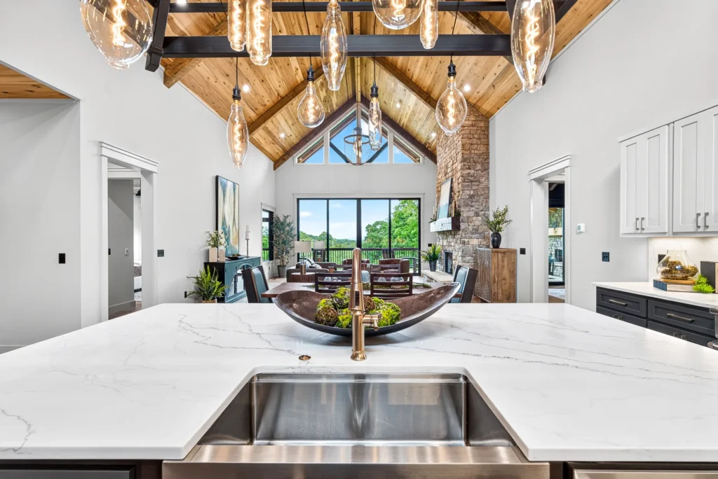 Kitchen island with pendant lights in a staged mountain home