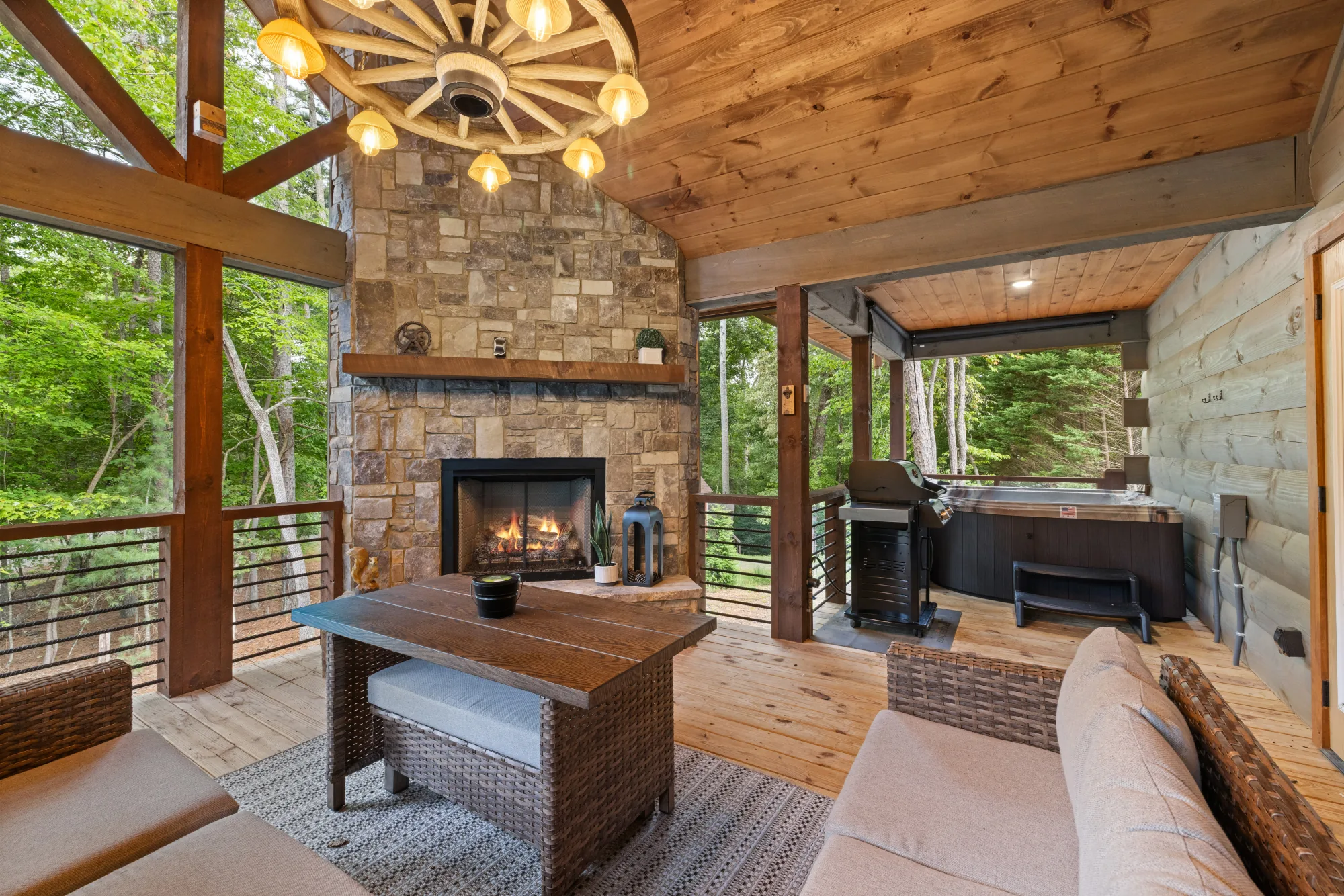 Back patio with fireplace and hot tub