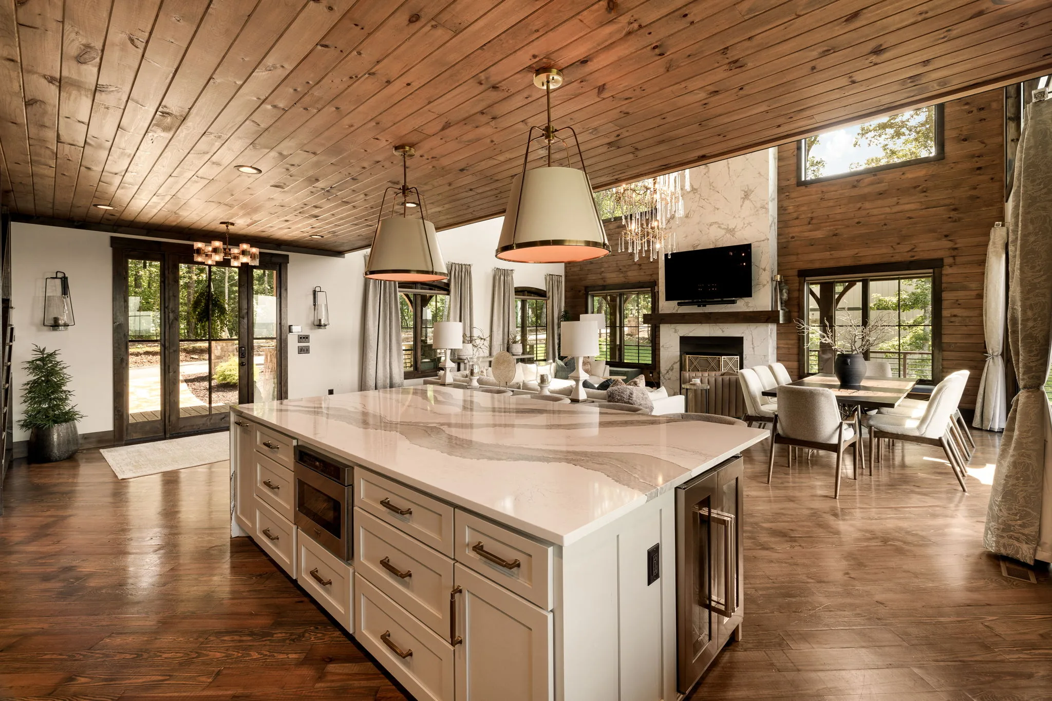 Kitchen island with breakfast bar and stone counters