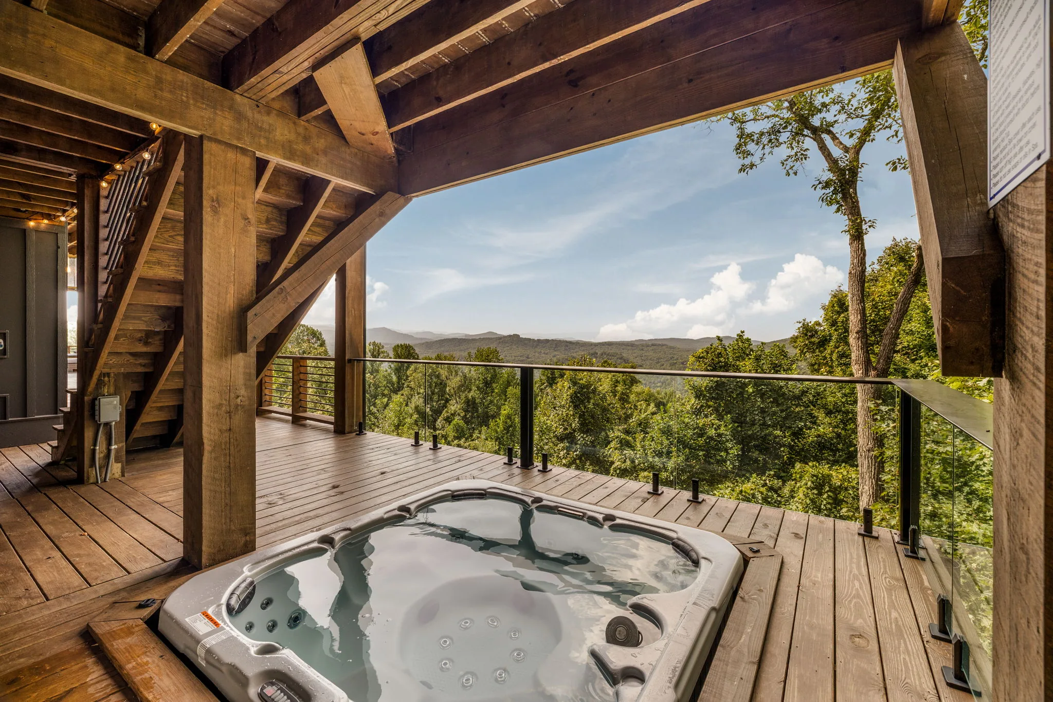Sunken hot tub with glass railings