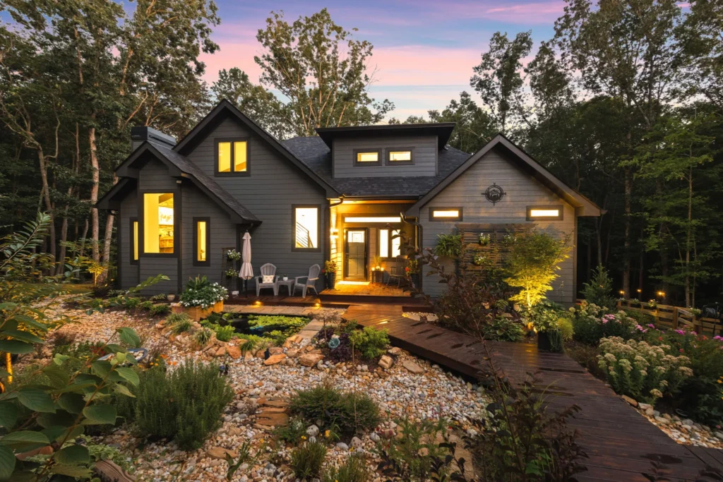 Twilight hero: interior lights on, koi pond and boardwalk lit