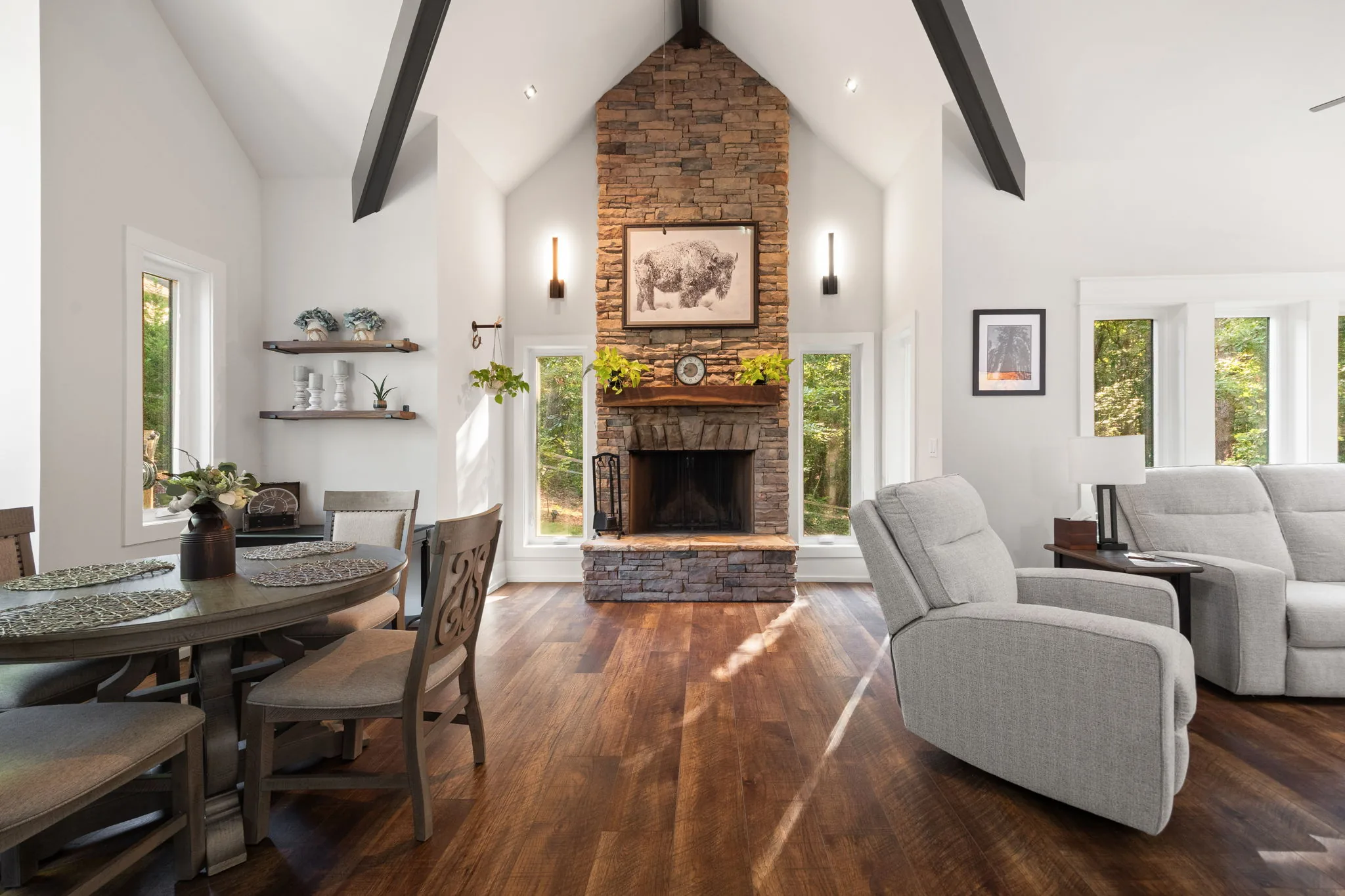 Hero: 17-ft floor-to-ceiling stacked stone fireplace with solid walnut mantle
