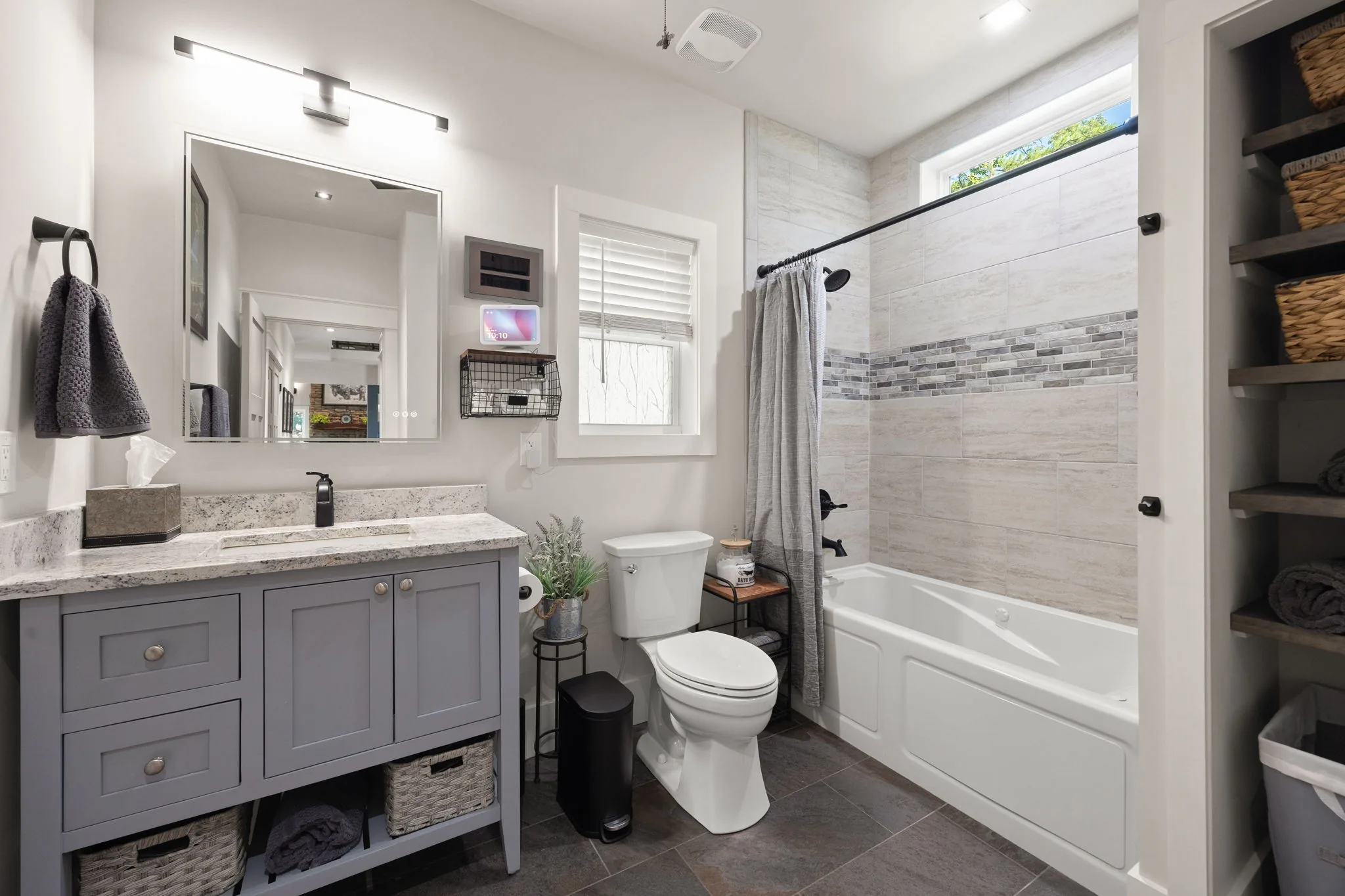 Granite vanity, heated anti-fog mirror and Jacuzzi jetted tub with in-line heater