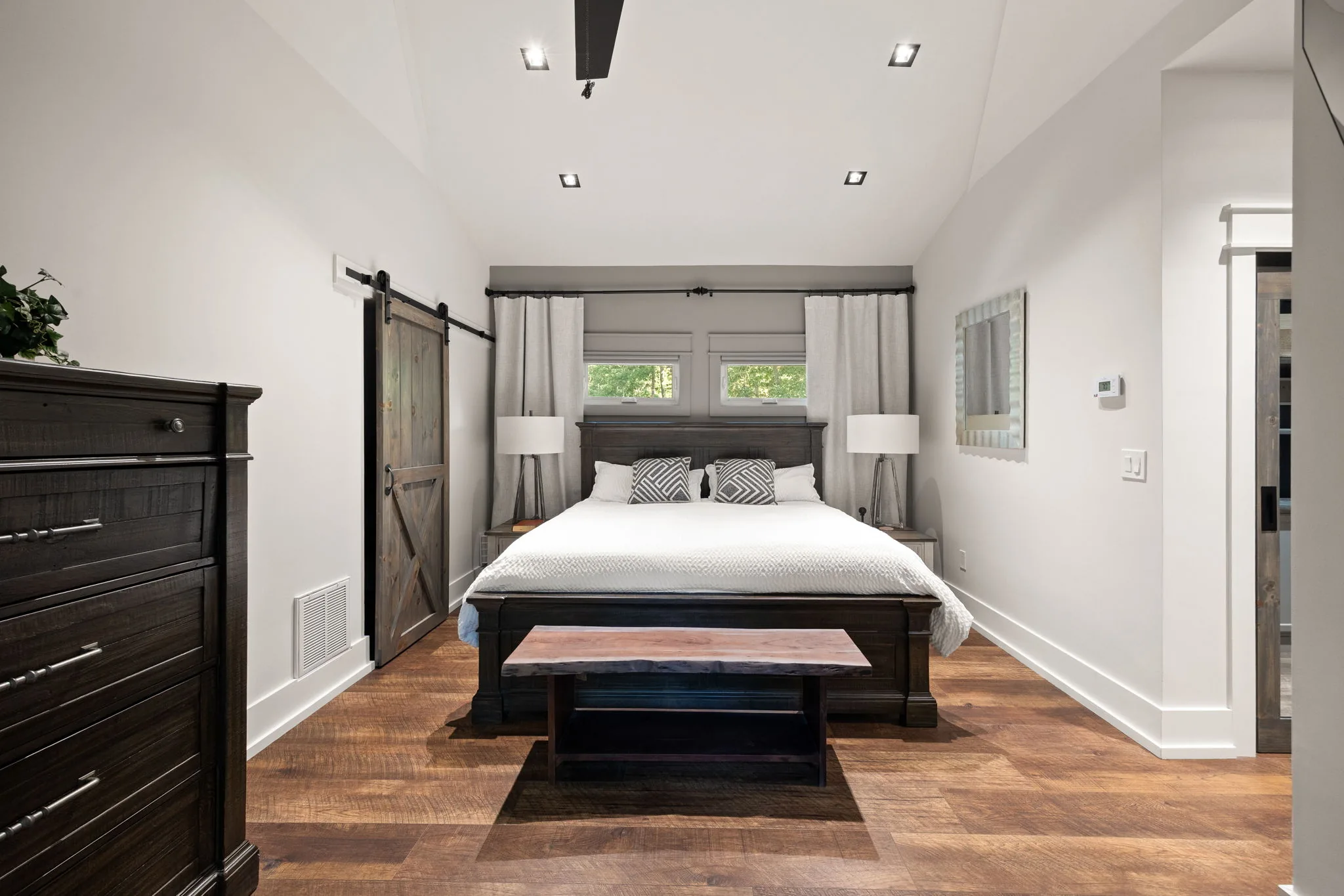 From the opposite corner showing the bed wall and both nightstands