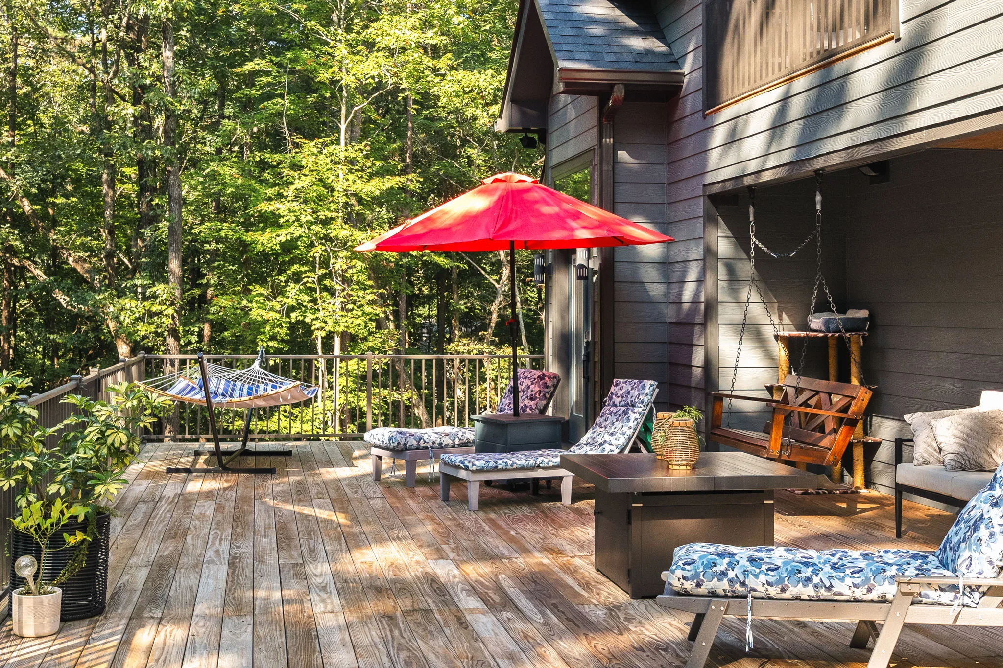 Hammock, porch swing, loungers and gas fire table