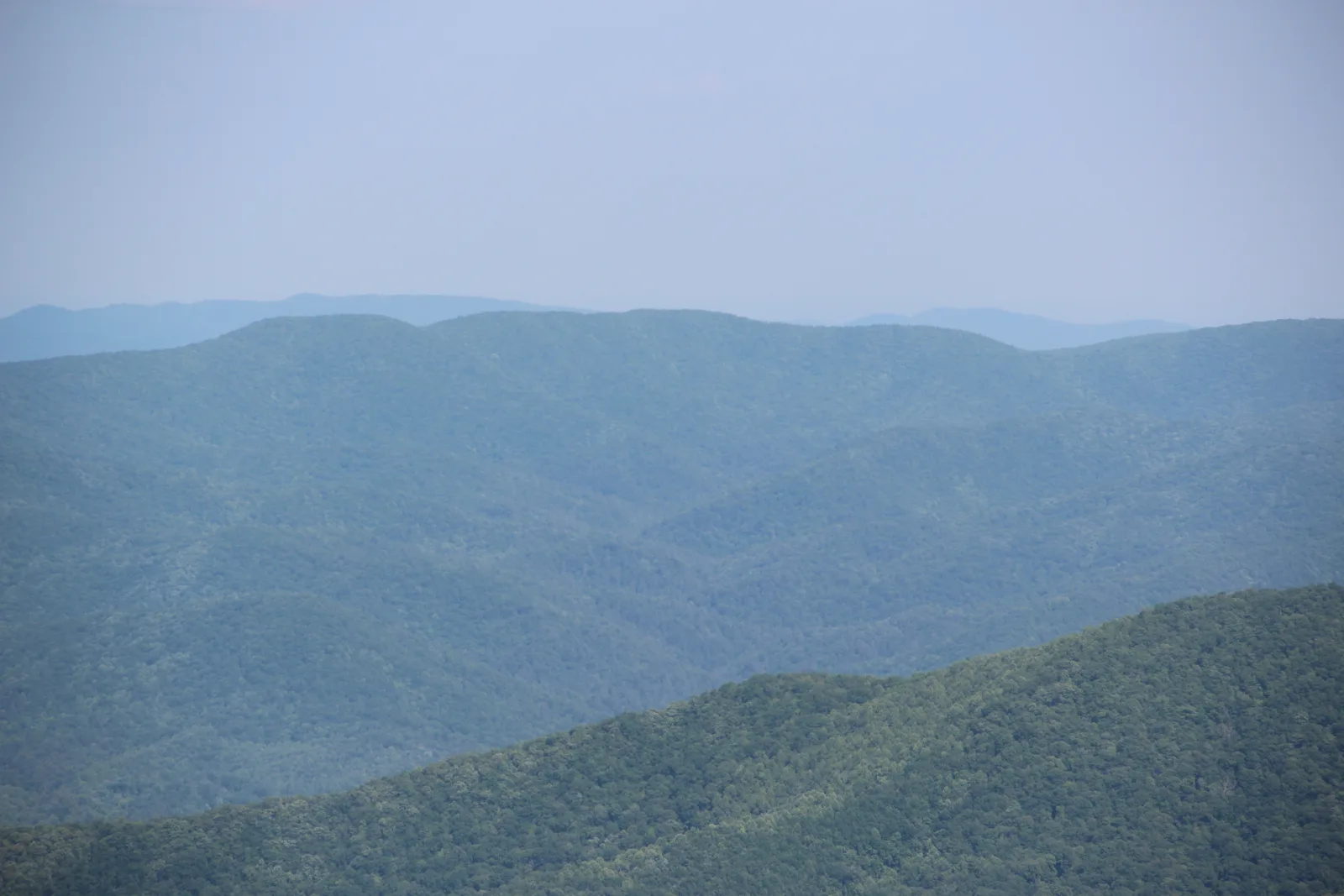 Long-range view of layered ridgelines in the North Georgia mountains from Brasstown Bald, looking toward Young Lick in late May